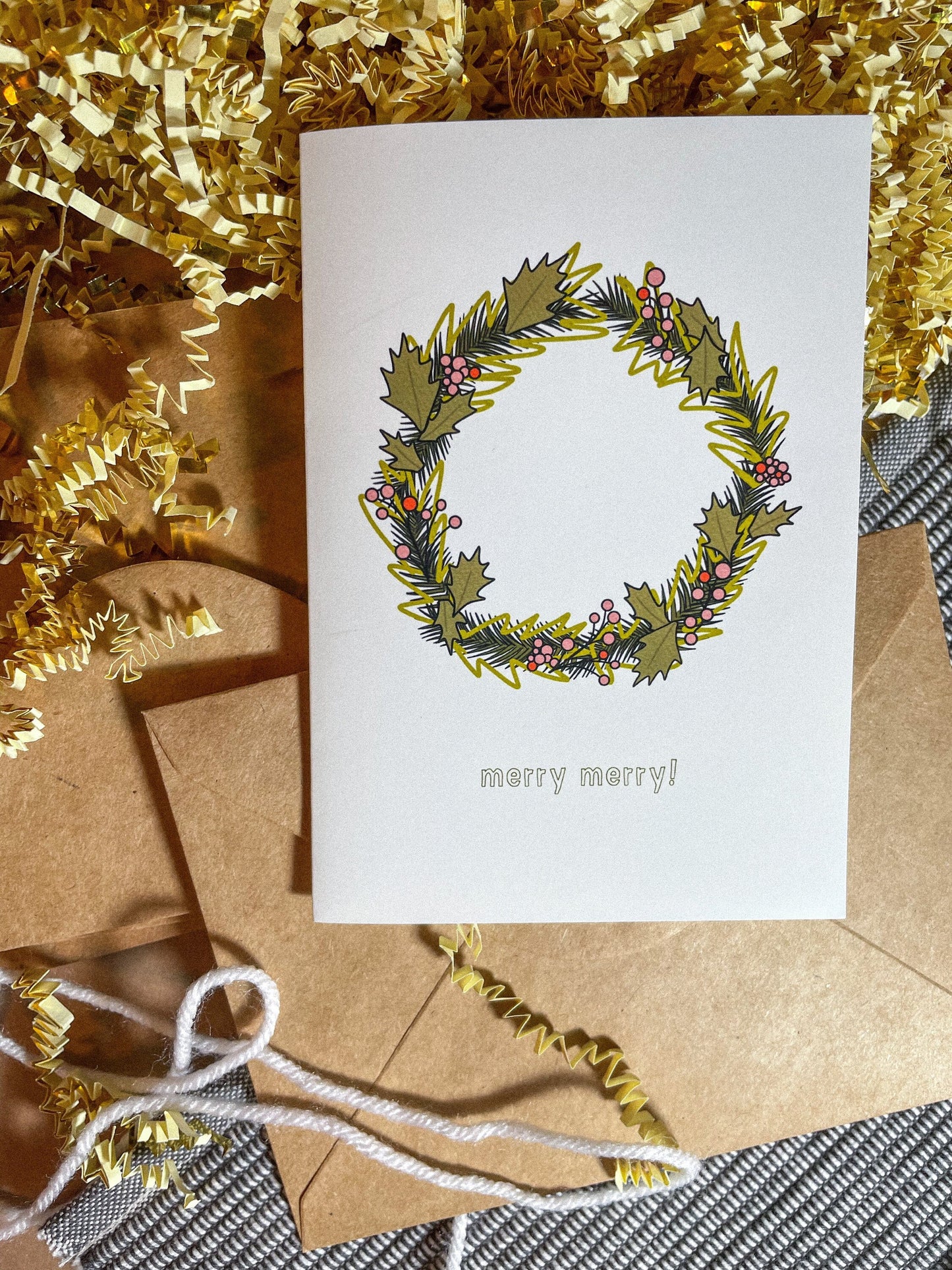 This card features a very merry Christmas wreath with the text 'merry merry!" It's the perfect Christmas card for anyone in your life!