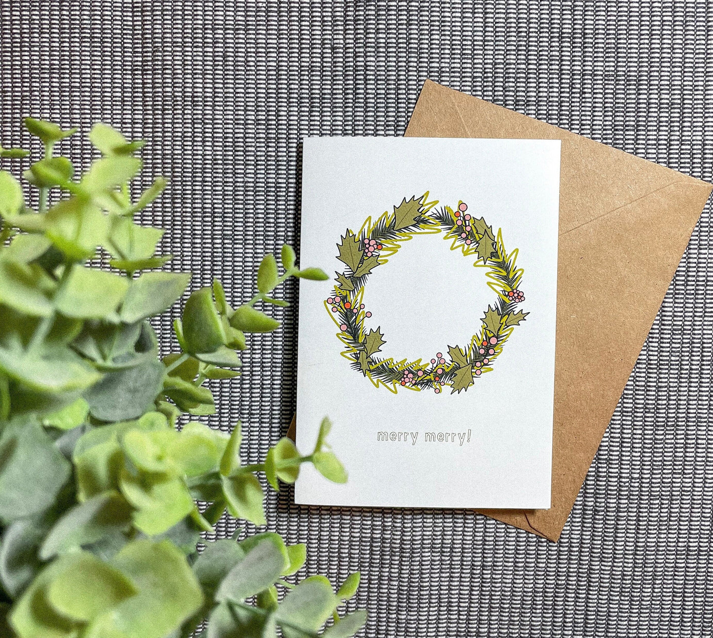 This card features a very merry Christmas wreath with the text 'merry merry!" It's the perfect Christmas card for anyone in your life!