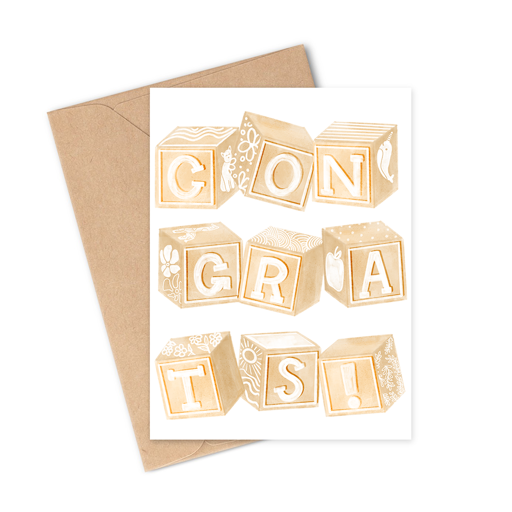 This card says "Congrats!" with a set of 9 hand-illustrated beige/brown wooden children's alphabet block toys covered in beautifully intricate drawings on various sides. The neutral colors make it the perfect gender-neutral card for any new, expecting mother or to pair with a gift to bring to a baby shower. 