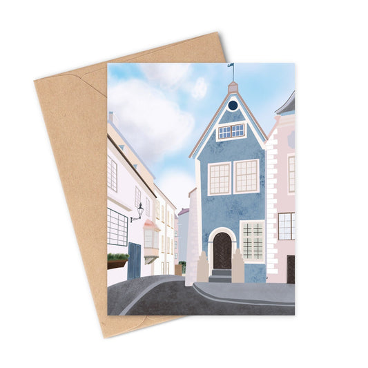 This unique greeting card is a hand-illustrated drawing of the main square in old town of Tallinn Estonia. Featuring a beautiful array of blue, white, and pink colors with a slightly cloudy sky.