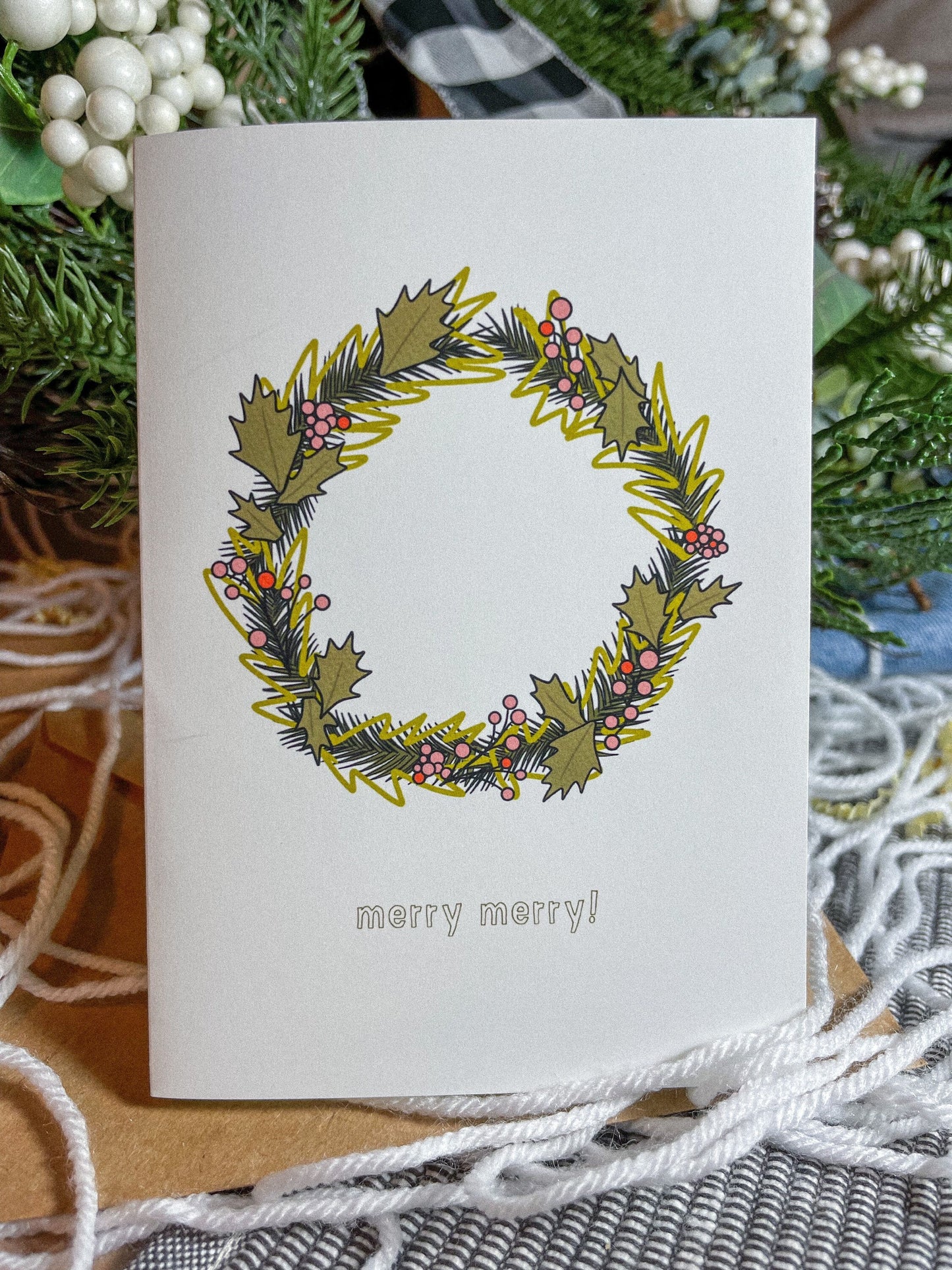 This card features a very merry Christmas wreath with the text 'merry merry!" It's the perfect Christmas card for anyone in your life! 