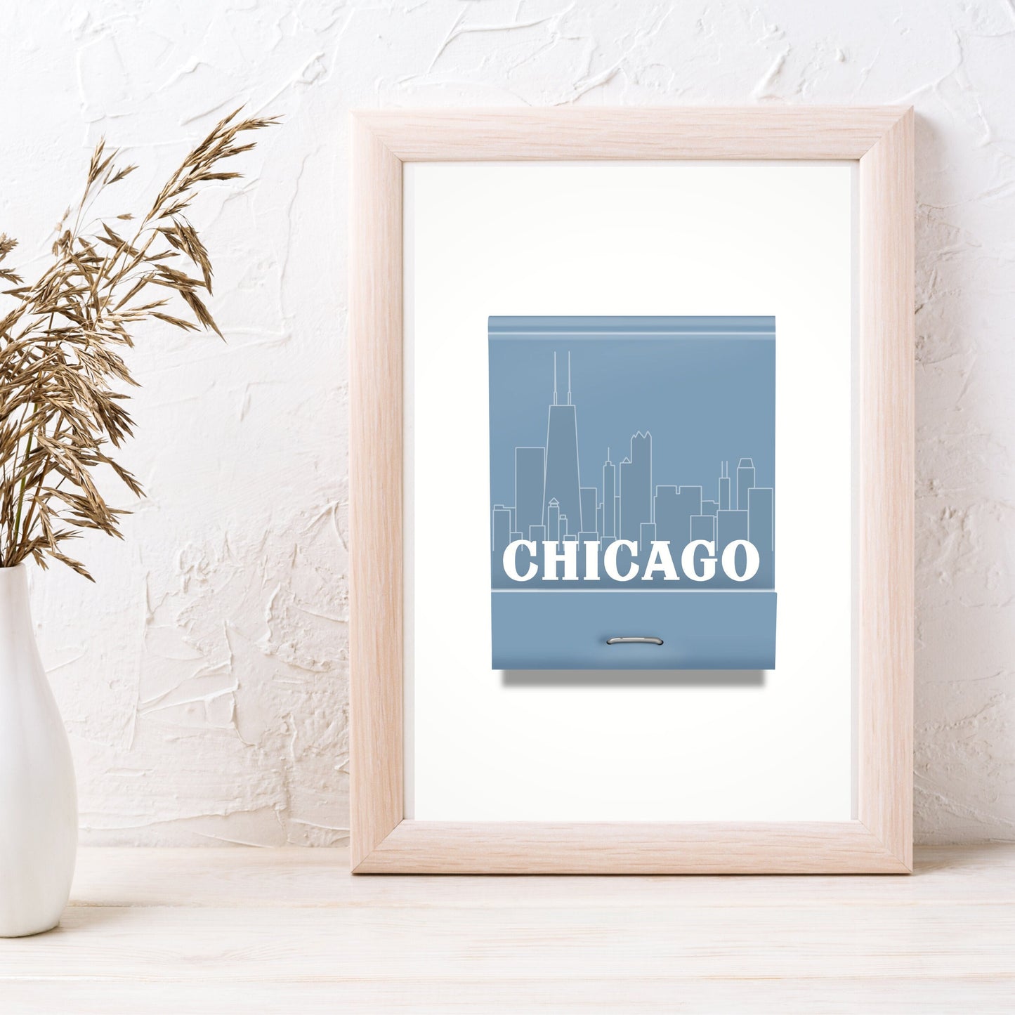 This wall art is a real conversation piece! It's completely hand drawn and features a blue matchbook with a line drawing of the Chicago skyline and the word Chicago over the cityscape. The perfect artwork for your Chicago house or apartment, or if you've moved away from Chicago it's a great reminder of that special city. It also makes a great Chicago souvenir or for a Chicago housewarming gift!