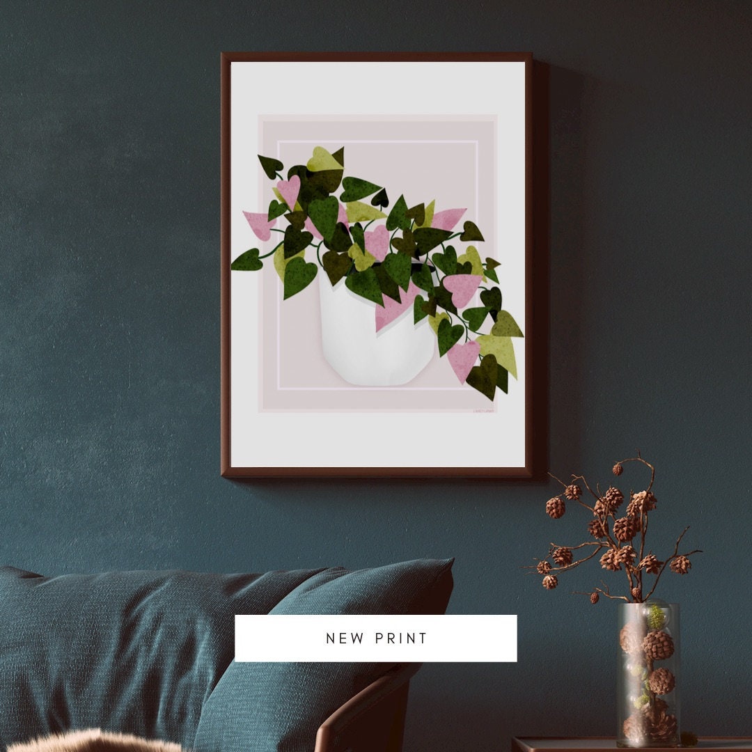 leafy wall art. floral art print. green and pink leaves in a white planter